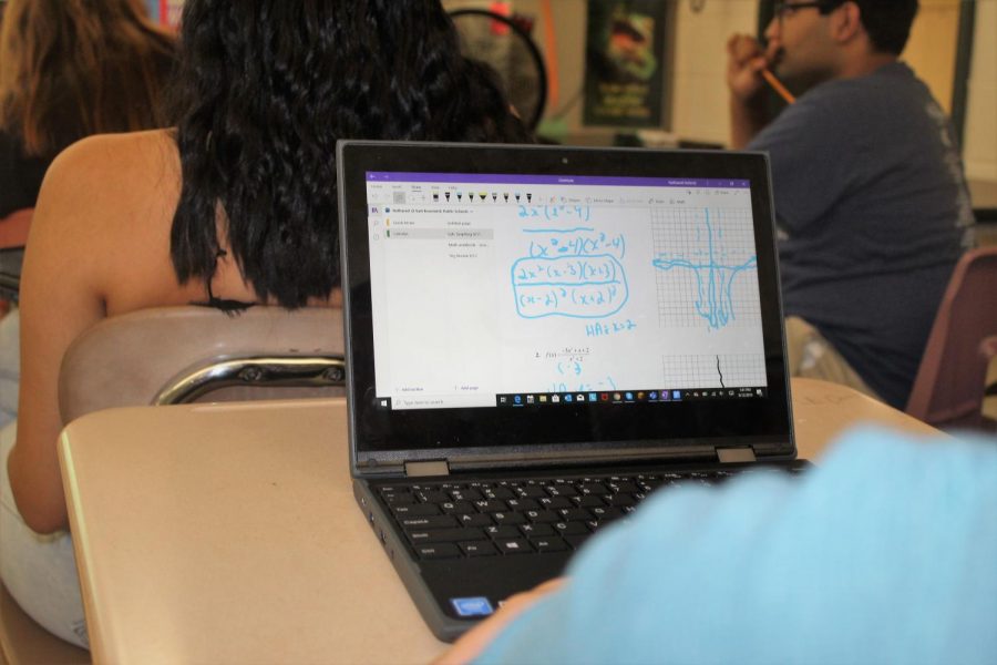A student completes the daily activity on his new Lenovo Thinkpad