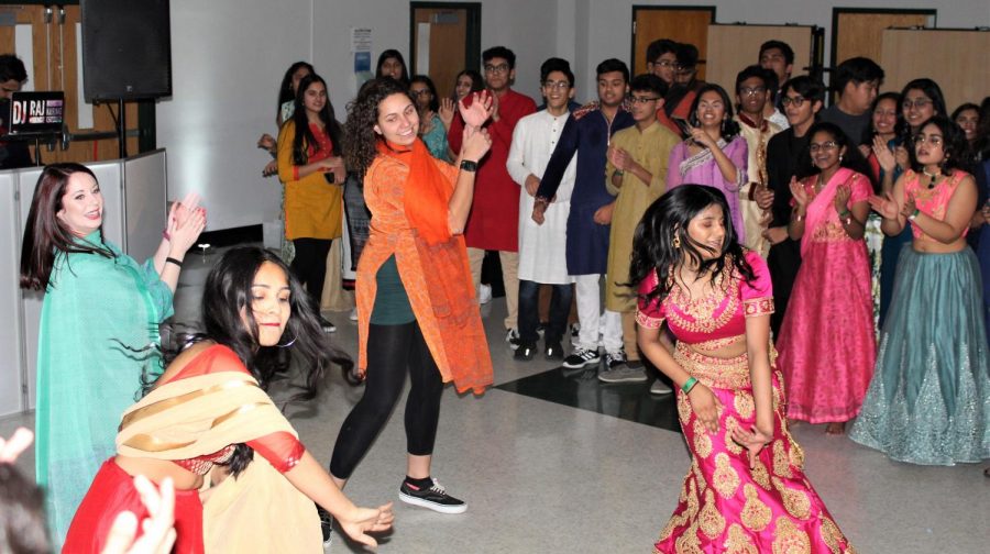 Ms. Schenk and Ms. Shanks along with two students perform a traditional Bollywood dance.