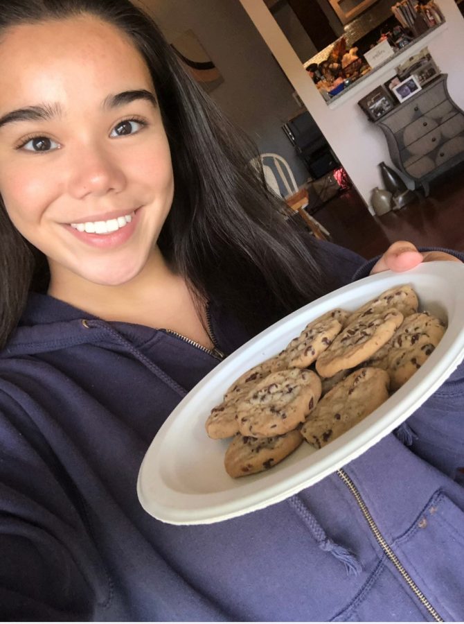 A selfie of Lillian Love with the cookies she just baked.