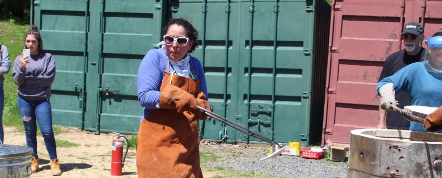 Ms. Hanania wields a wicked-looking tool to grab onto items after being fired in Ceramics.