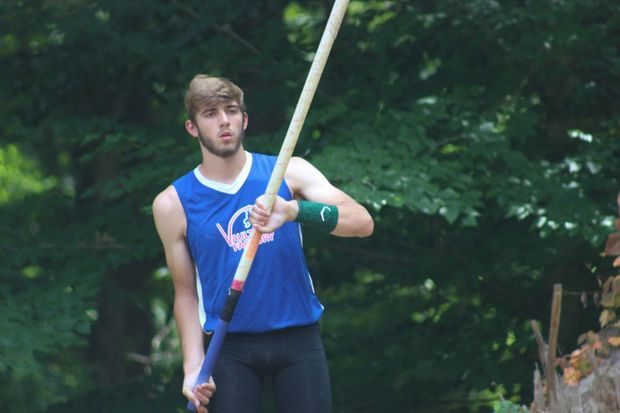 Brian Mcsweeney, Senior, stares down the runway at one of the few summer pole vaulting meets. 
