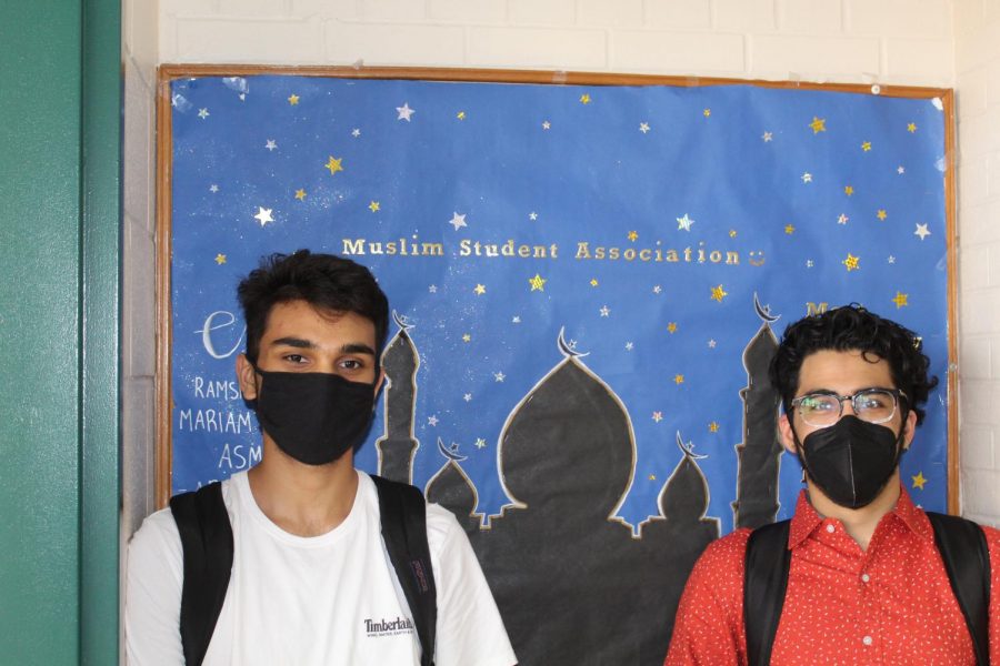 Saad and Shaheer, board memebrs of MSA  hang up their poster hoping to recruit new members.