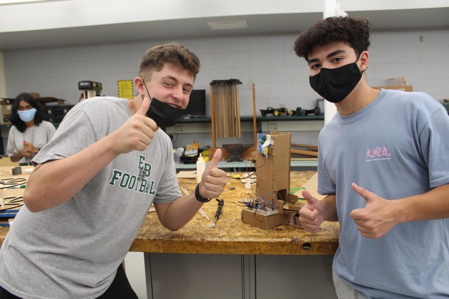  Zach Driscoll (12) and Thomas Jaycard (12) work on their project in Capstone Engineering, hoping the light will show up in their box.
