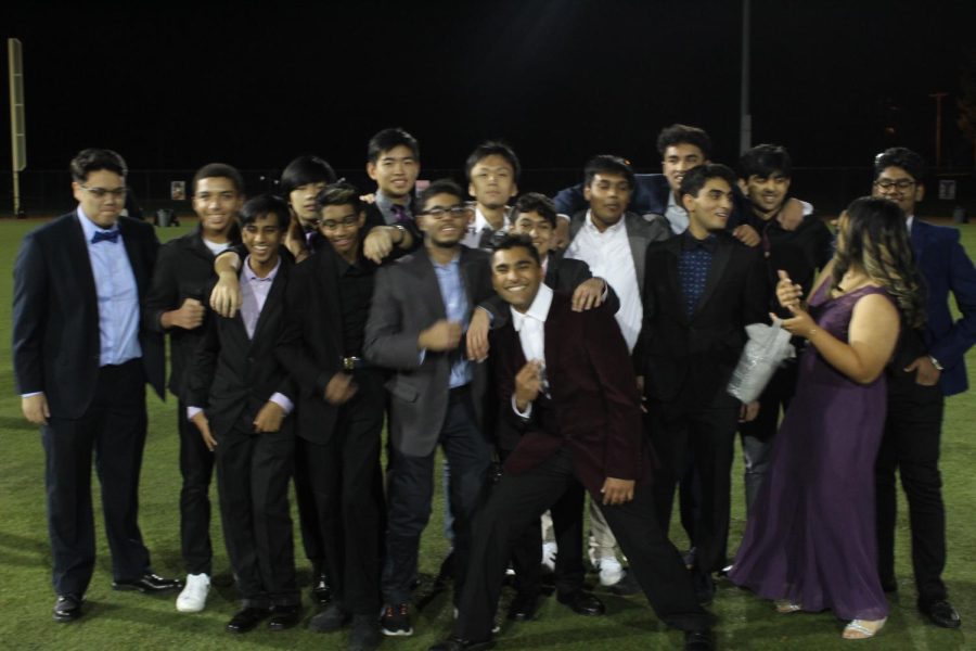 A group of students were so excited about homecoming that they couldnt even stand still for a photo.