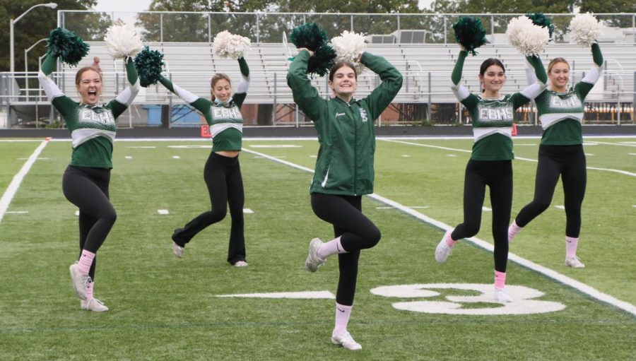 Alyssa Russo (12), Julia Schaer (12), Jenna Piscopiello (12), Paige Rockaway (11), and Chloe Green (12) are extra excited as they practice one of their cheers. 