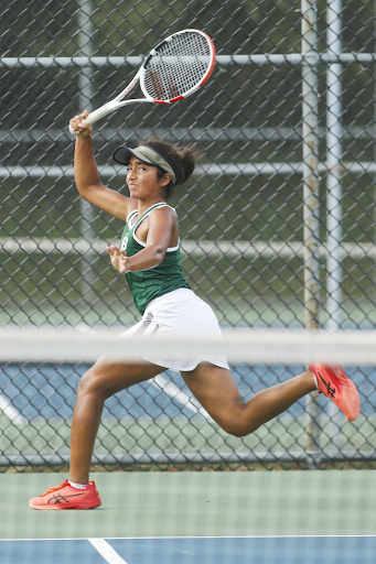 Naomi Karki, 11, runs to hit a return in first singles during the Greater Middlesex Conference girls tennis finals at Thomas Edison Park. 