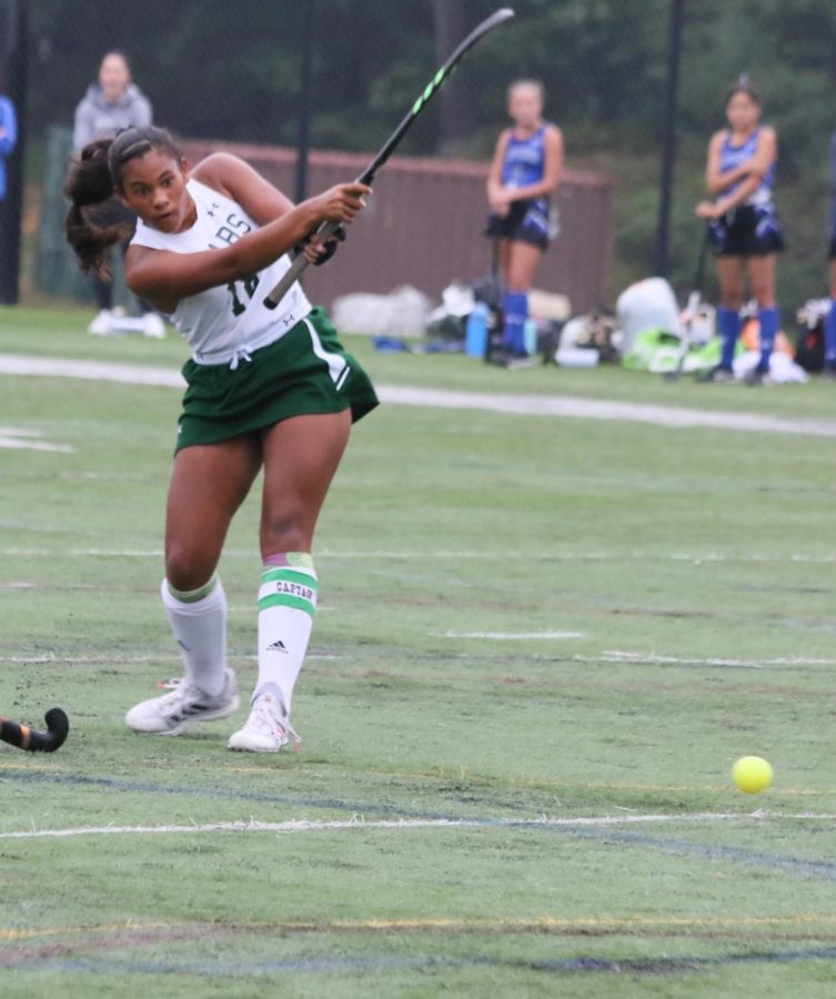 Senior Natalie Arnold uses her power to make an incredible hit towards the goal. 