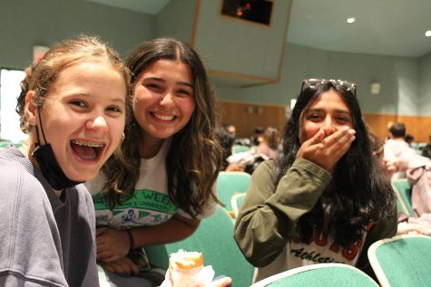 Elisabeth Post, 10, and Layla Sheikh, 10, laugh at a funny story about her cat that Veronica Losada, 10, tells them during their lunch period.