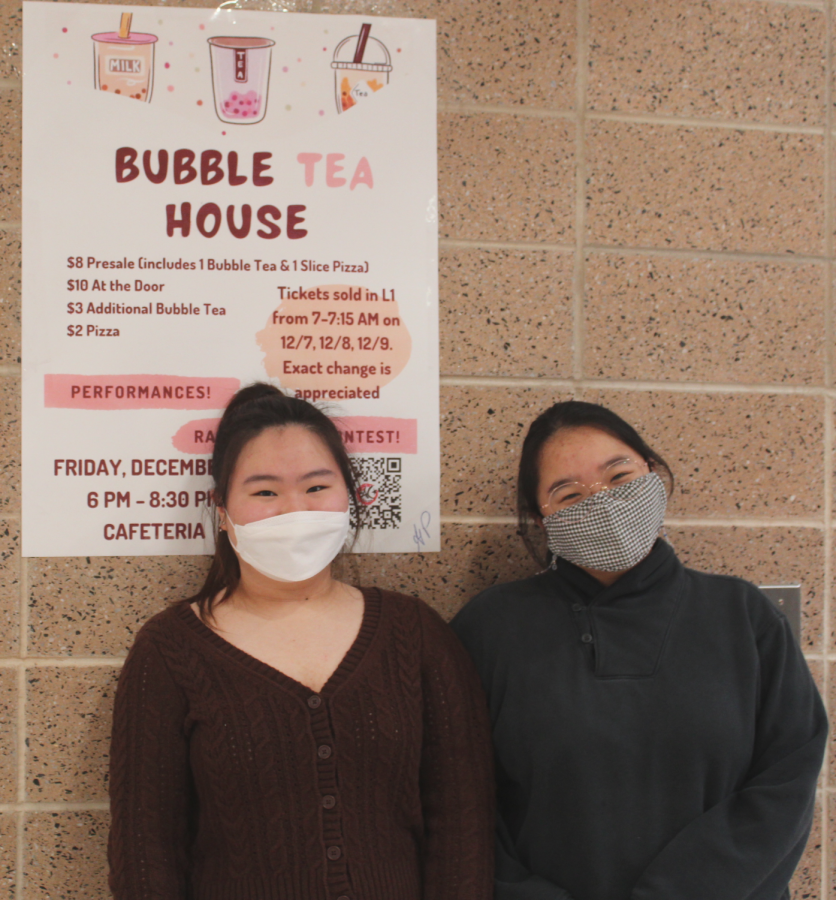 The Co-Vice President and Secretary Julie Kim, 11, and Rachel Kam, 11, in front of their cute Bubble Tea House advertisement, proud that the executive board’s planning for the event is finally done. 