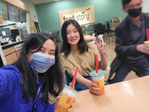 Close friends Heidi So 12, Weilin Chu 12, with photobombing Nicolas Vinco 12 enjoying the boba flavors they love together in Lotte Market. 