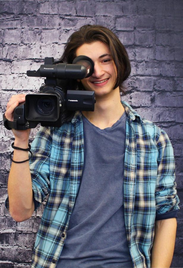 Eilam Ben-Zvi, 12, holds up a video camera to represent his passion he has for film and the Video News Makers Club. 