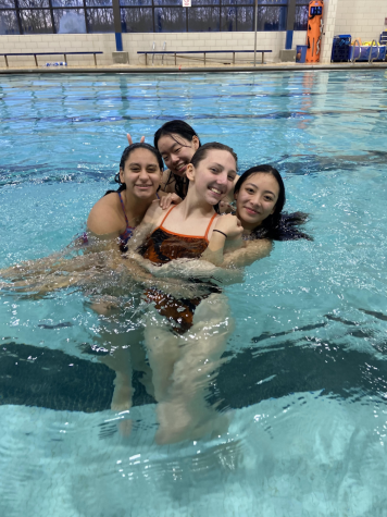 LEFT Seniors Mary Egalayer, Gabby Salvador, junior Megan Tsang and sophomore Abigail Simonovsky make the most of the last day of practice of the swimming season. Goofing around is an essential part of practice to keep the team chemistry strong. 