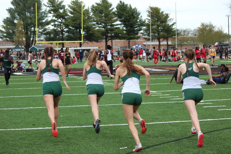 Sophomores+Grace+Smutko%2C+Hannah+Oranchak%2C+Maddy+Sauvigne+and+Freshman+Allison+Zeichner+warmup+up+for+their+1600+minutes+before+the+meet+was+canceled.