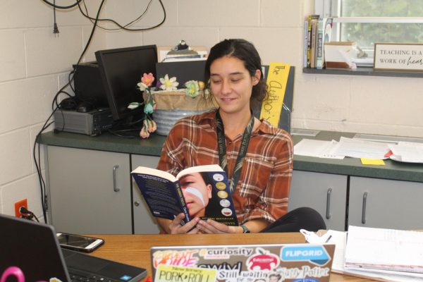 Ms. Murray reading The Narrow Thieves by Cherie Dimaline. 

